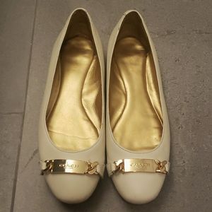 Off white leather coach flats 7.5 w/gold buckle